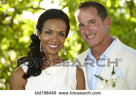 Stock Photo - Bride and groom standing together. Fotosearch