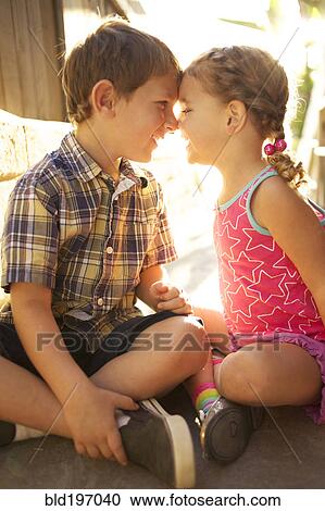 Brother and sister looking at each other View Large Photo Image Stock Image - Brother and sister looking at each other. Fotosearch