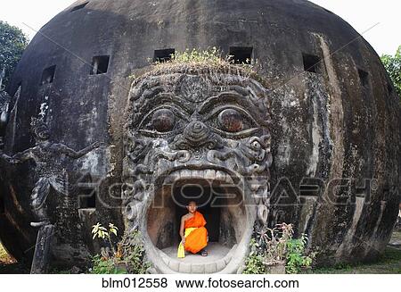 Buddhist monk inside of historical temple View Large Photo Image Stock Photo - Buddhist monk inside of historical temple. Fotosearch