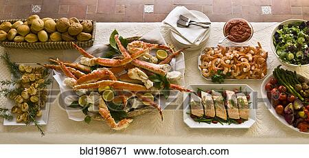 Stock Image - Buffet of delicious food. Fotosearch