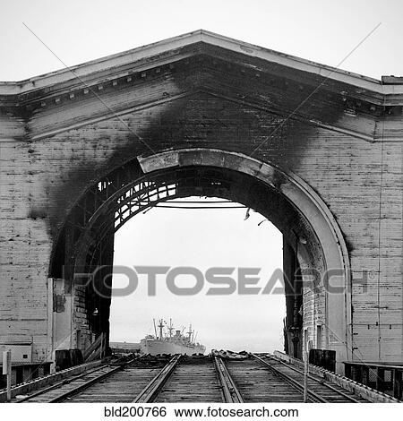 Burned arch over railroad tracks View Large Photo Image Stock Photograph - Burned arch over railroad tracks. Fotosearch