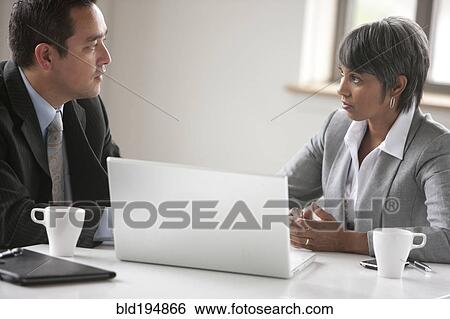 Stock Photograph - Business people in meeting. Fotosearch