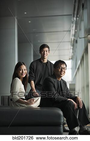 Stock Photograph - Business people sitting together. Fotosearch