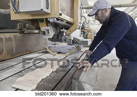 Carpenter working in woodshop View Large Photo Image Stock Image - Carpenter working in woodshop. Fotosearch