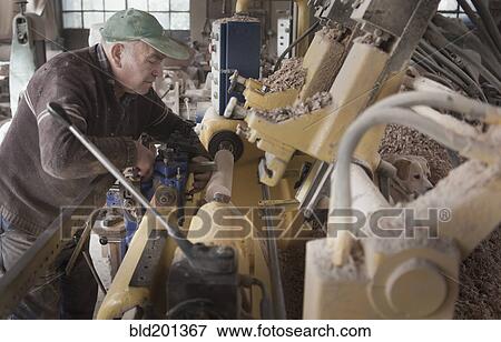 Carpenter working in woodshop View Large Photo Image Stock Photo - Carpenter working in woodshop. Fotosearch