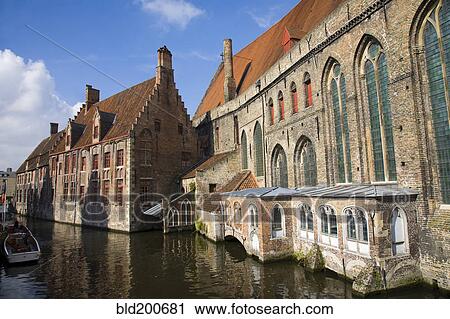Stock Image - Cathedral and buildings on canal. Fotosearch