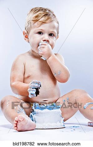 Caucasian baby eating birthday cake View Large Photo Image Stock Image - Caucasian baby eating birthday cake. Fotosearch