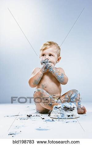 Caucasian baby eating birthday cake View Large Photo Image Stock Image - Caucasian baby eating birthday cake. Fotosearch