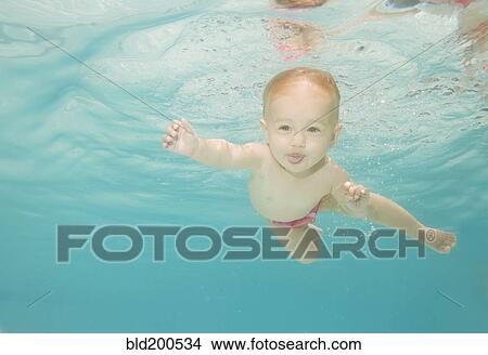 Caucasian baby swimming underwater View Large Photo Image Picture - Caucasian baby swimming underwater. Fotosearch