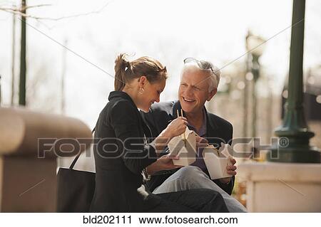 Caucasian business people eating Asian food View Large Photo Image Stock Image - Caucasian business people eating Asian food. Fotosearch