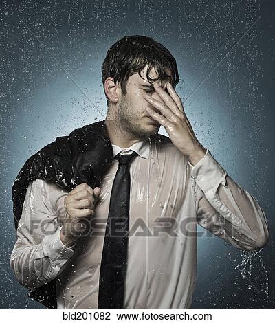 Caucasian businessman standing in the rain View Large Photo Image Stock Image - Caucasian businessman standing in the rain. Fotosearch