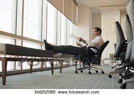 Caucasian businessman working in conference room View Large Photo Image Stock Photo - Caucasian businessman working in conference room. Fotosearch