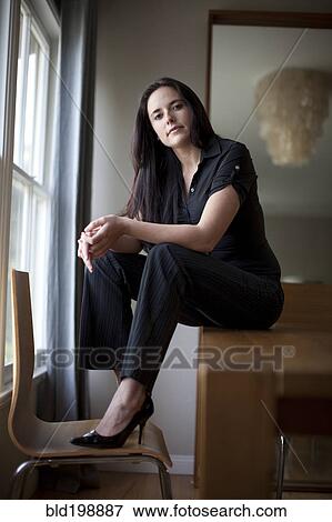 Stock Photo - Caucasian businesswoman sitting in table. Fotosearch