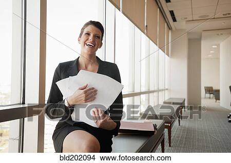 Picture - Caucasian businesswoman working in conference room. Fotosearch
