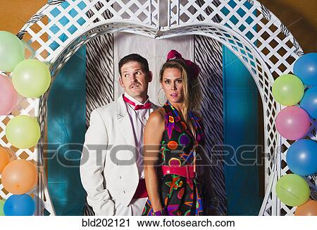Stock Image - Caucasian couple at retro prom. Fotosearch