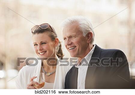 Stock Photograph - Caucasian couple drinking wine. Fotosearch