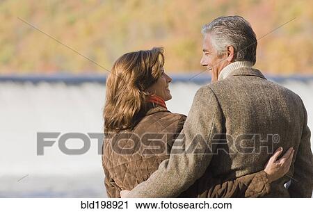 Caucasian couple hugging outdoors View Large Photo Image Stock Image - Caucasian couple hugging outdoors. Fotosearch