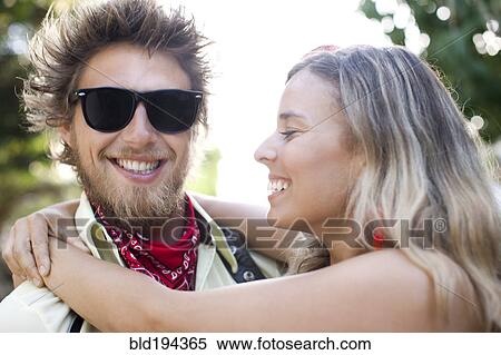 Stock Photography - Caucasian couple hugging. Fotosearch