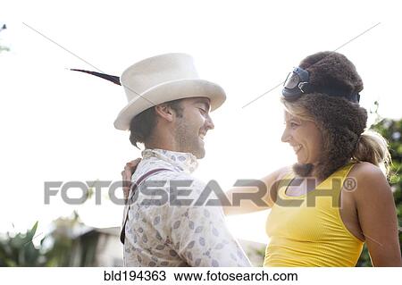 Caucasian couple in funny hats hugging View Large Photo Image Stock Image - Caucasian couple in funny hats hugging. Fotosearch