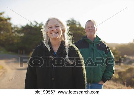 Stock Photo - Caucasian couple standing outdoors. Fotosearch