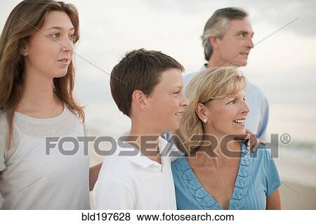 Caucasian family enjoying beach View Large Photo Image Stock Photo - Caucasian family enjoying beach. Fotosearch