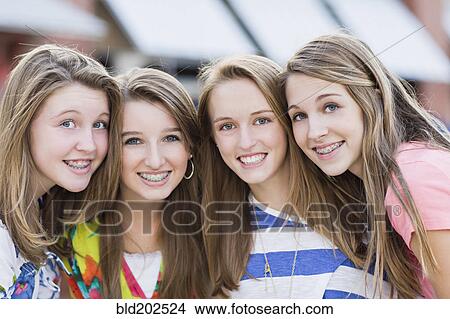Picture - Caucasian friends hanging out together. Fotosearch