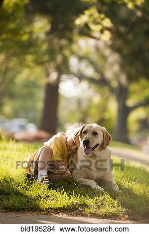 Caucasian girl playing with dog in yard View Large Photo Image Picture - Caucasian girl playing with dog in yard. Fotosearch