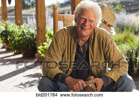Caucasian man carving wood View Large Photo Image Picture - Caucasian man carving wood. Fotosearch