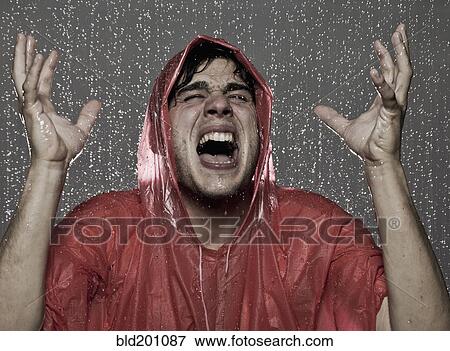 Stock Photo - Caucasian man caught in the rain. Fotosearch