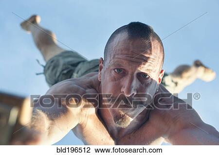 Caucasian man doing handstand View Large Photo Image Stock Image - Caucasian man doing handstand. Fotosearch