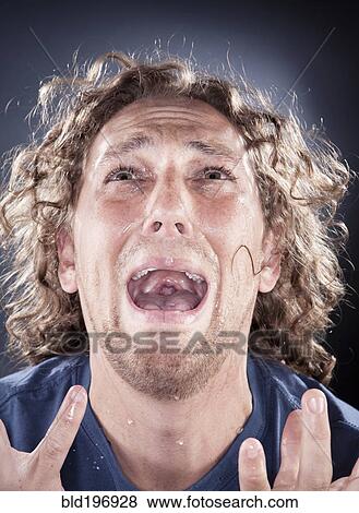 Caucasian man looking up and shouting View Large Photo Image Stock Photo - Caucasian man looking up and shouting. Fotosearch