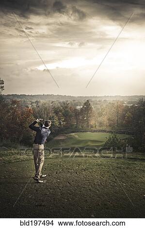Picture - Caucasian man playing golf. Fotosearch