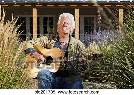 Caucasian man playing guitar View Large Photo Image Stock Photography - Caucasian man playing guitar. Fotosearch
