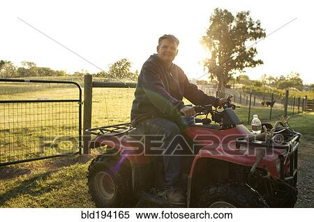 Stock Photography - Caucasian man riding leisure vehicle. Fotosearch