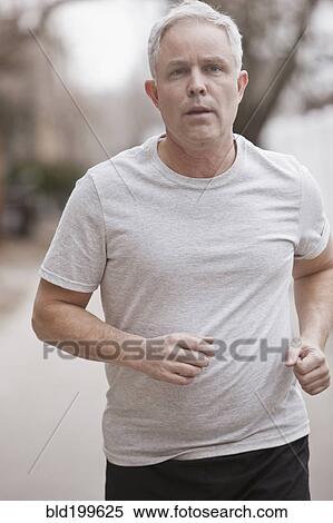Stock Photography - Caucasian man running. Fotosearch