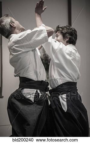 Caucasian people practicing martial arts View Large Photo Image Stock Image - Caucasian people practicing martial arts. Fotosearch