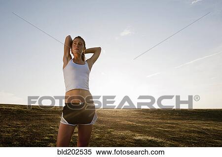 Caucasian runner stretching before exercise View Large Photo Image Stock Photography - Caucasian runner stretching before exercise. Fotosearch