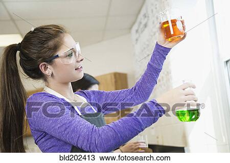 Caucasian student working with chemicals in classroom View Large Photo Image Stock Image - Caucasian student working with chemicals in classroom. Fotosearch