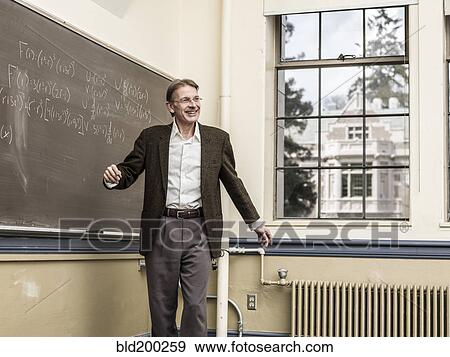 Caucasian teacher talking in classroom View Large Photo Image Stock Photo - Caucasian teacher talking in classroom. Fotosearch