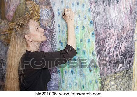 Caucasian woman drawing mural on wall View Large Photo Image Stock Photograph - Caucasian woman drawing mural on wall. Fotosearch