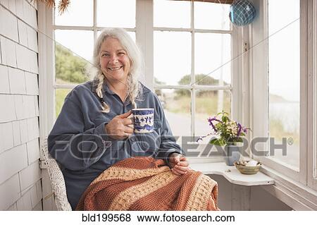 Stock Photo - Caucasian woman drinking coffee. Fotosearch