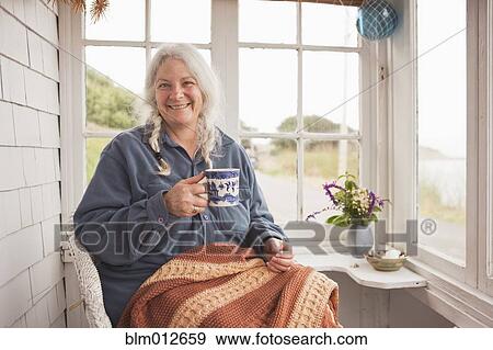 Stock Photo - Caucasian woman drinking coffee. Fotosearch