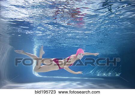 Caucasian woman in bikini swimming underwater View Large Photo Image Stock Image - Caucasian woman in bikini swimming underwater. Fotosearch