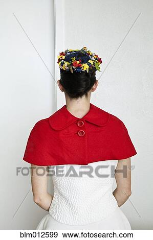 Stock Photo - Caucasian woman in fashionable red cape. Fotosearch