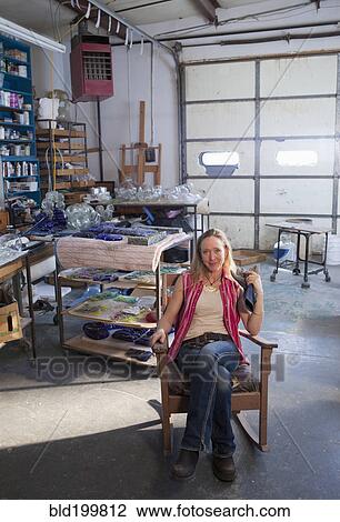 Caucasian woman in glass blowing studio View Large Photo Image Stock Image - Caucasian woman in glass blowing studio. Fotosearch