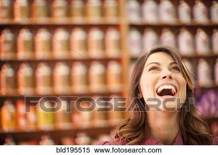 Caucasian woman looking up and laughing View Large Photo Image Stock Photography - Caucasian woman looking up and laughing. Fotosearch