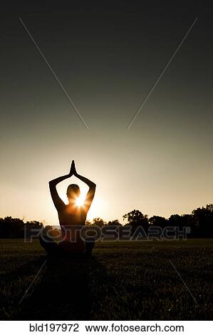 Caucasian woman practicing yoga at sunset View Large Photo Image Stock Image - Caucasian woman practicing yoga at sunset. Fotosearch