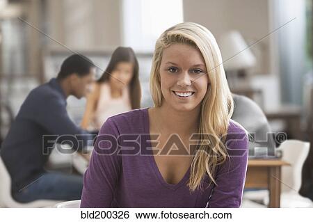 Caucasian woman studying with friends View Large Photo Image Stock Photograph - Caucasian woman studying with friends. Fotosearch