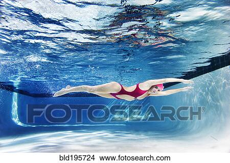Caucasian woman swimming underwater View Large Photo Image Picture - Caucasian woman swimming underwater. Fotosearch