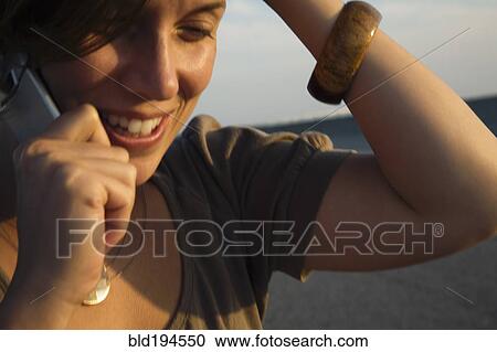Caucasian woman talking on cell phone View Large Photo Image Stock Image - Caucasian woman talking on cell phone. Fotosearch